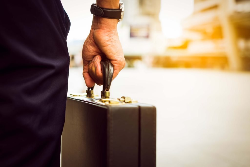 Person holding a business suitcase